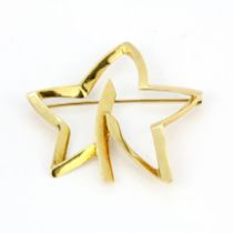An 18ct yellow gold Tiffany & Co star shaped brooch, L. 5.2cm.