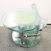 An interesting sliding three section cut glass and chrome circular coffee table, H. 44cm top section