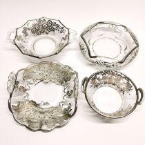 A group of four silver overlaid glass table items, widest W. 17cm.