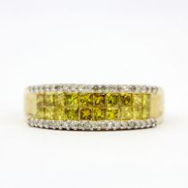 A 9ct yellow gold ring set with princess cut fancy yellow diamonds and brilliant cut diamonds, (S).