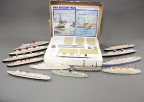 A Minic ship's ocean terminal with a collection of diecast model ships, longest L. 25cm.