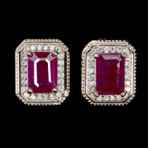 A pair of rose gold on 925 silver earrings set with emerald cut rubies and white stones, L. 1cm.