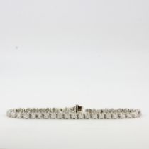 A 9ct white gold diamond set tennis bracelet, L. 18cm. Clasp A/F.