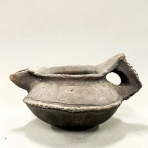 An early terracotta milk jug designed for heating over a fire, probably Swat Valley (Pakistan/