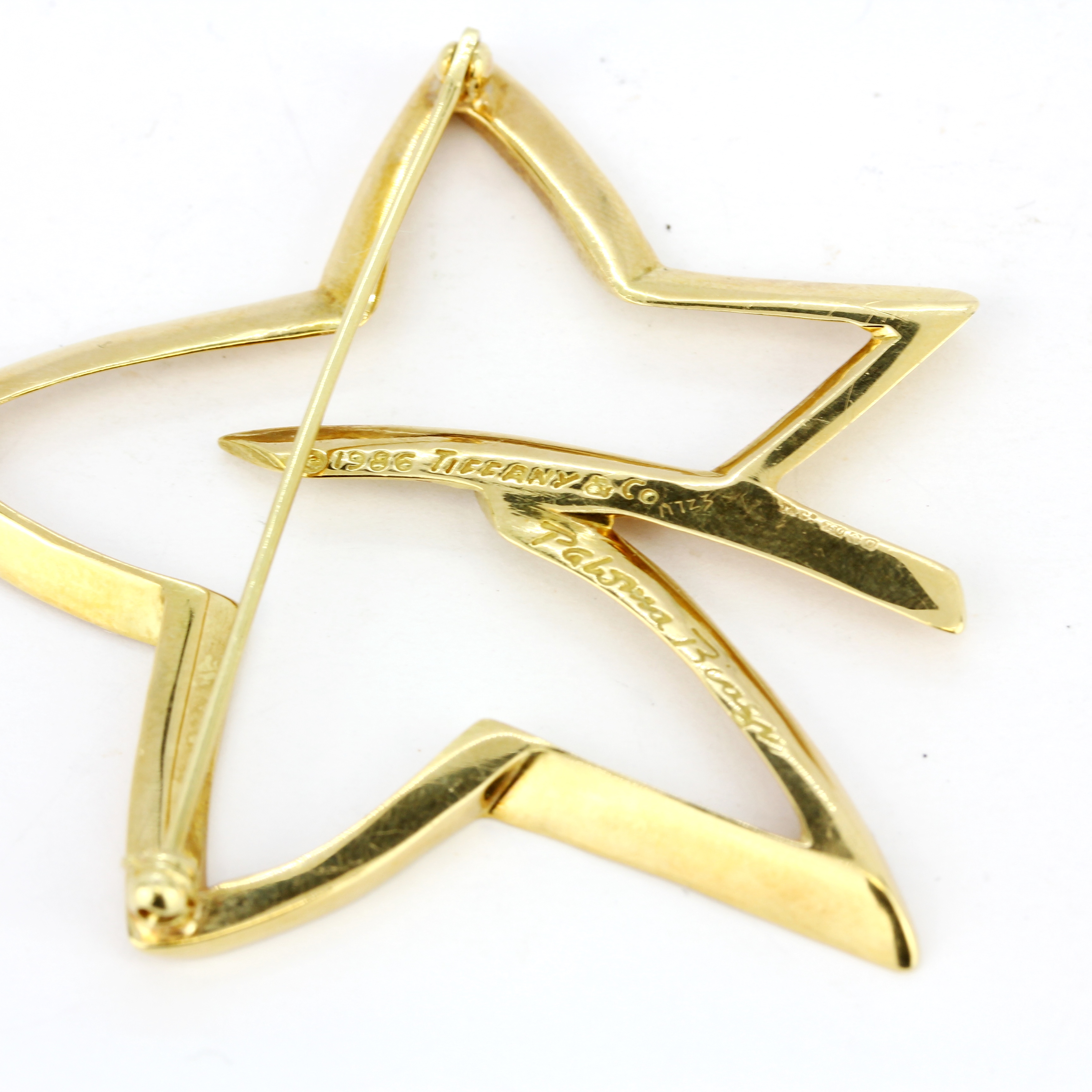 An 18ct yellow gold Tiffany & Co star shaped brooch, L. 5.2cm. - Image 3 of 3