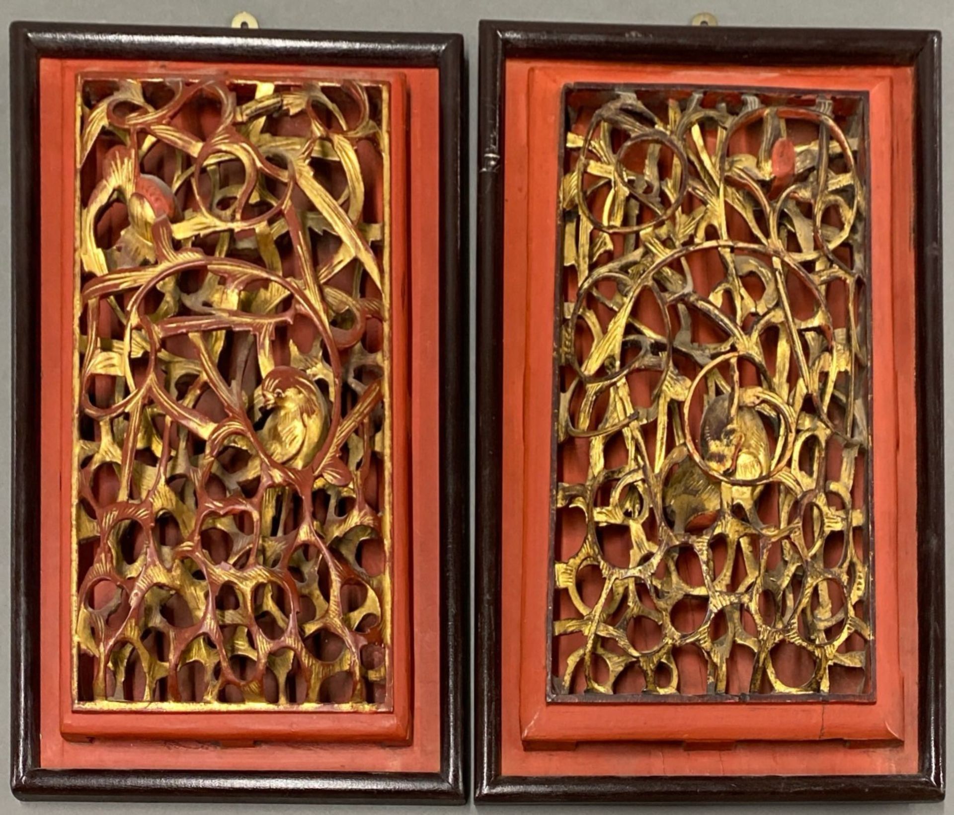 Two Chinese carved wooden panels, 22 x 35cm.