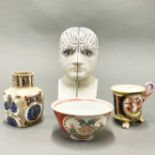 A pair of porcelain head bookends, H. 21cm, together with three further items.