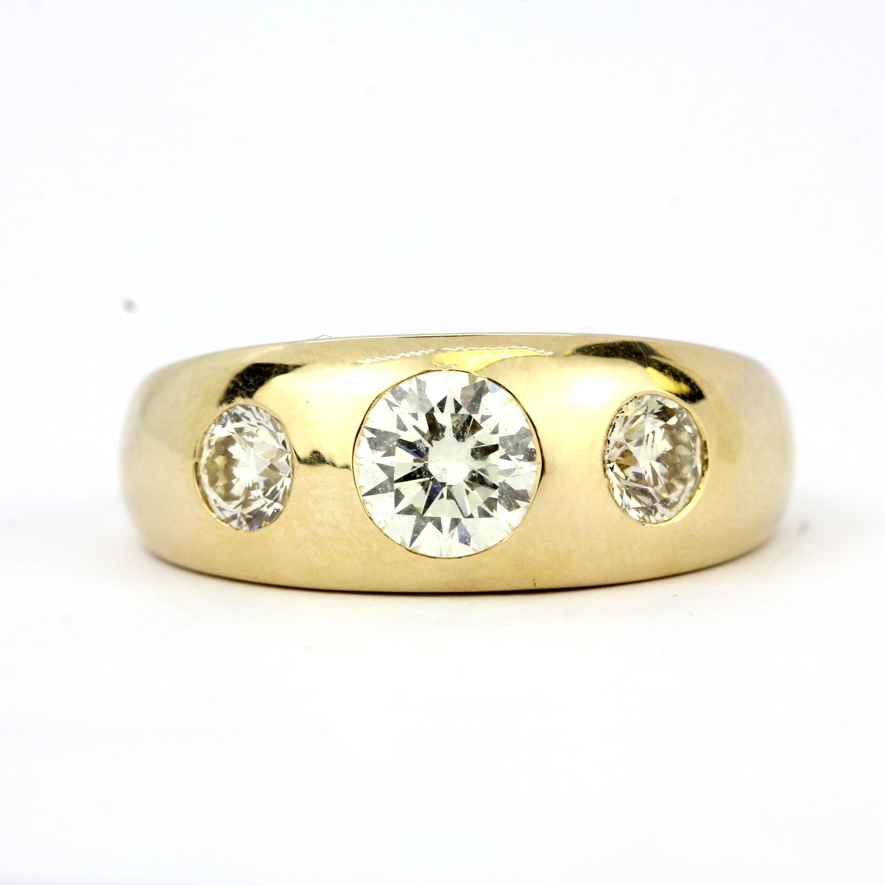 A 9ct yellow gold (stamped 9K) ring set with three brilliant cut fancy yellow diamonds, approx. 1.