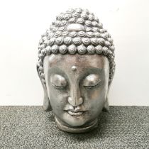 A silvered composition Buddha head, H. 34cm.
