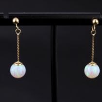 A pair of 9ct gold opal set drop earrings, L. 2.5cm. One butterfly missing.