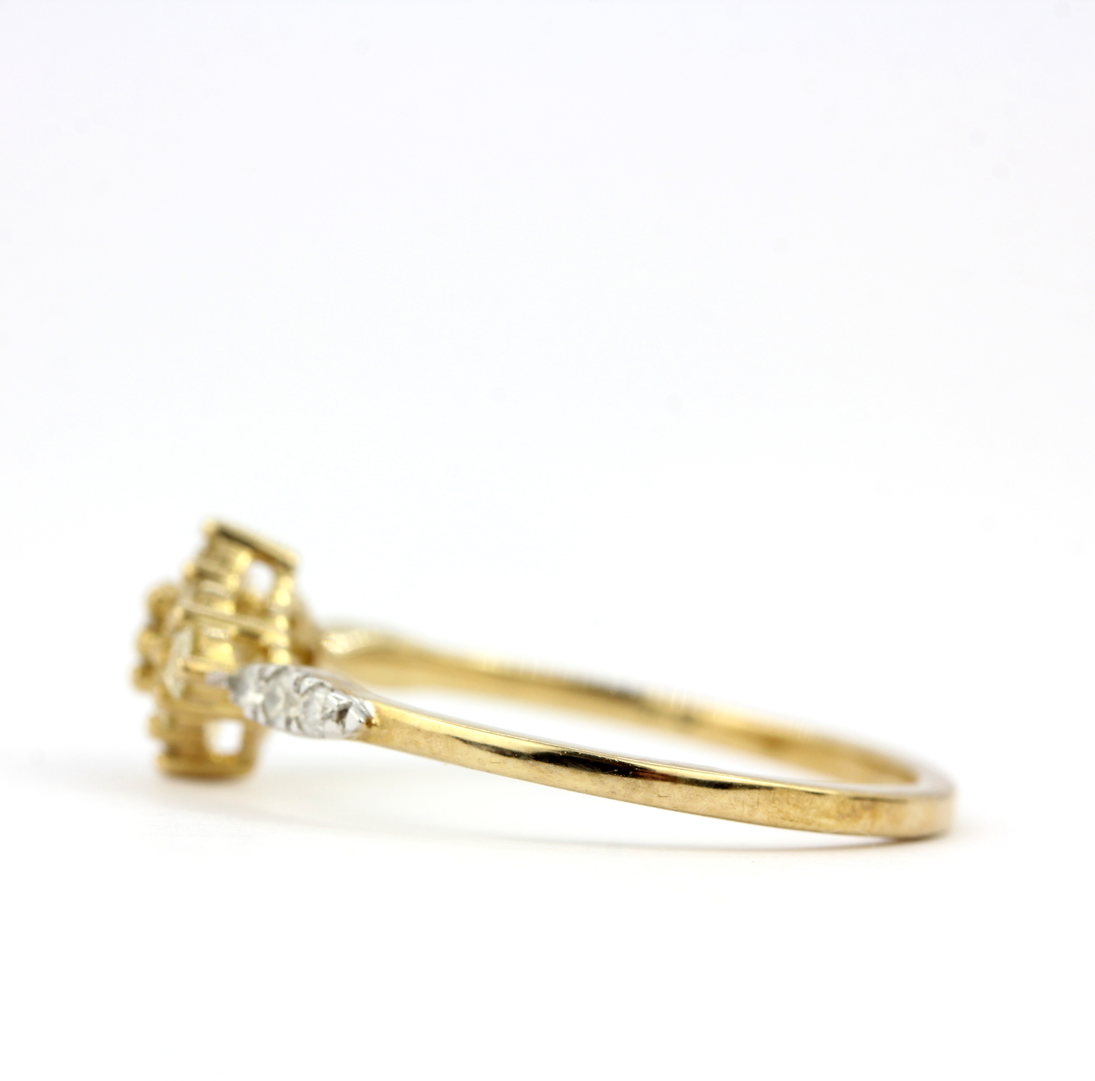 A 9ct yellow gold ring set with fancy yellow diamonds and diamond set shoulders, (O). - Image 2 of 3