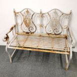 A two seater cast iron garden bench, L. 120cm H. 100cm.