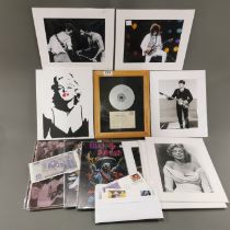 A quantity of pop and rock related photographs and other items.