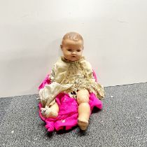 A large antique composition child's doll, L. 54cm.