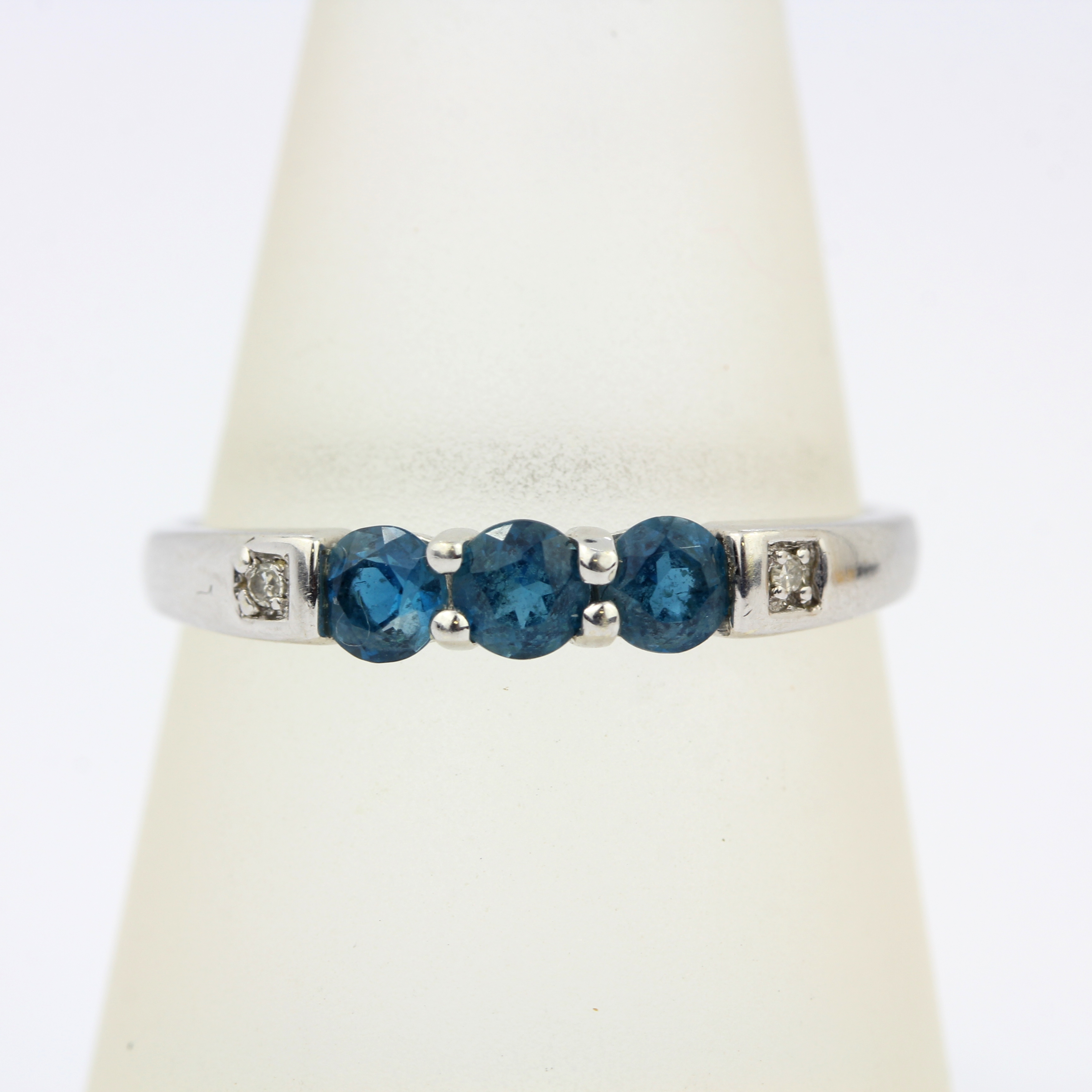 A 9ct white gold ring set with brilliant cut fancy blue diamonds and diamond set shoulders, (Q.5). - Image 3 of 3