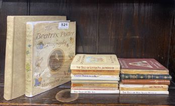 A collection of volumes of Beatrix Potter stories and biography.