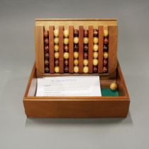 A wooden table game known as 'The Captain's Mistress', box size 29 x 23 x 8cm.