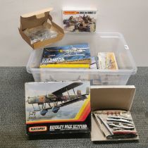 A box of mixed model kits.
