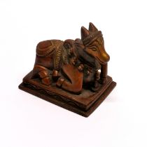 An Indian bronze figure of a sacred cow, H. 7cm.