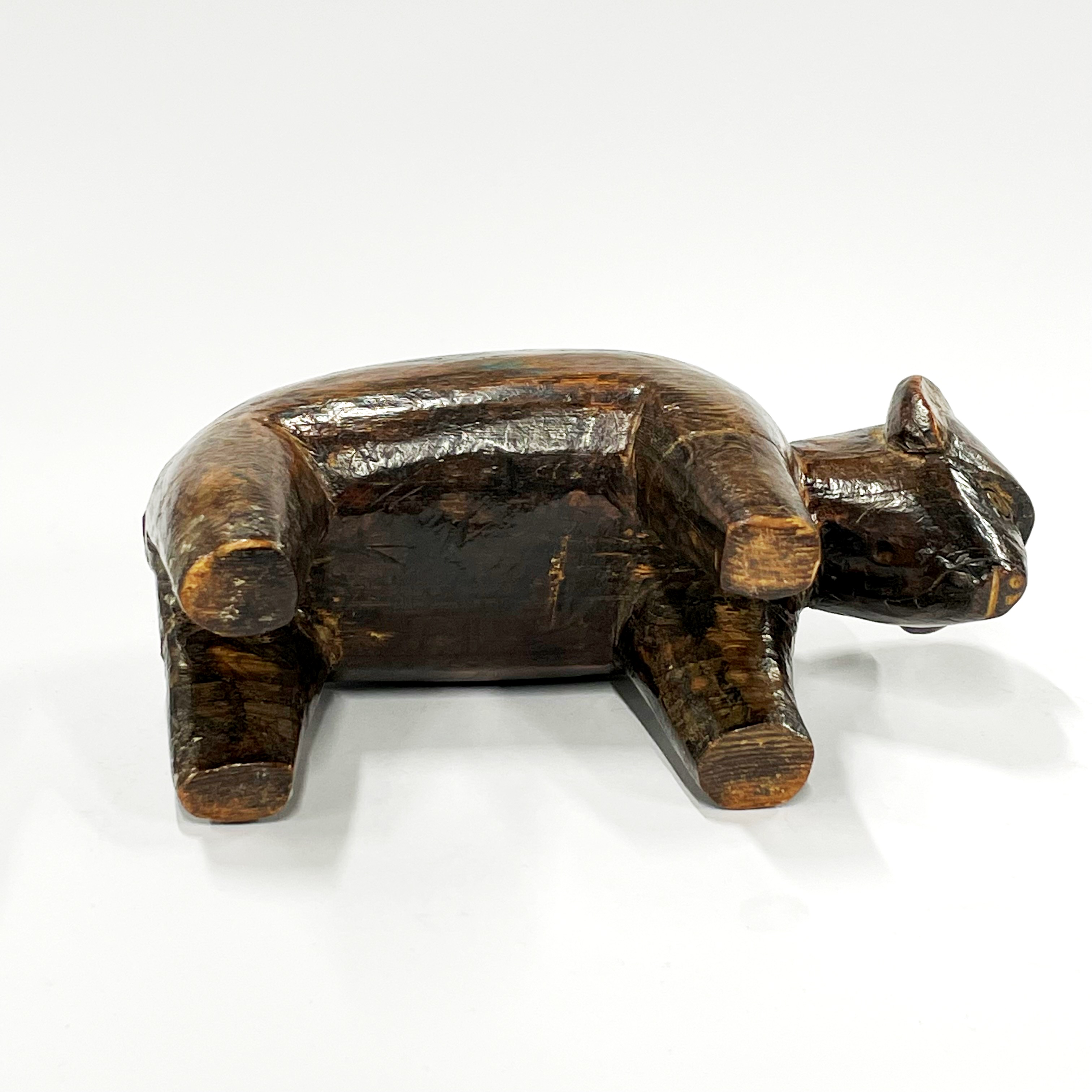 A 19th / early 20th century African tribal carved wooden bull figure, L. 18cm, H. 12cm. Some - Image 3 of 4