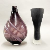A lavender glass vase together with a further interesting black glass vase, tallest H. 34cm.