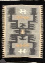 A handwoven Navaho primitive style rug 'storn' by Elise Whitehouse, 60 x 45cm.