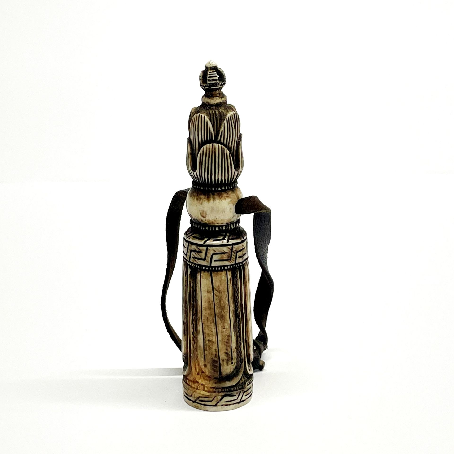 A Tibetan carved yak bone seal, H. 11.5cm.