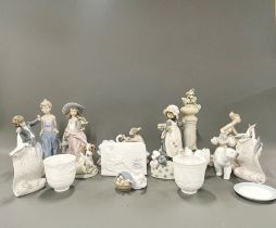 A large collection of Lladro, Nao and other porcelain figures, tallest H. 30cm.