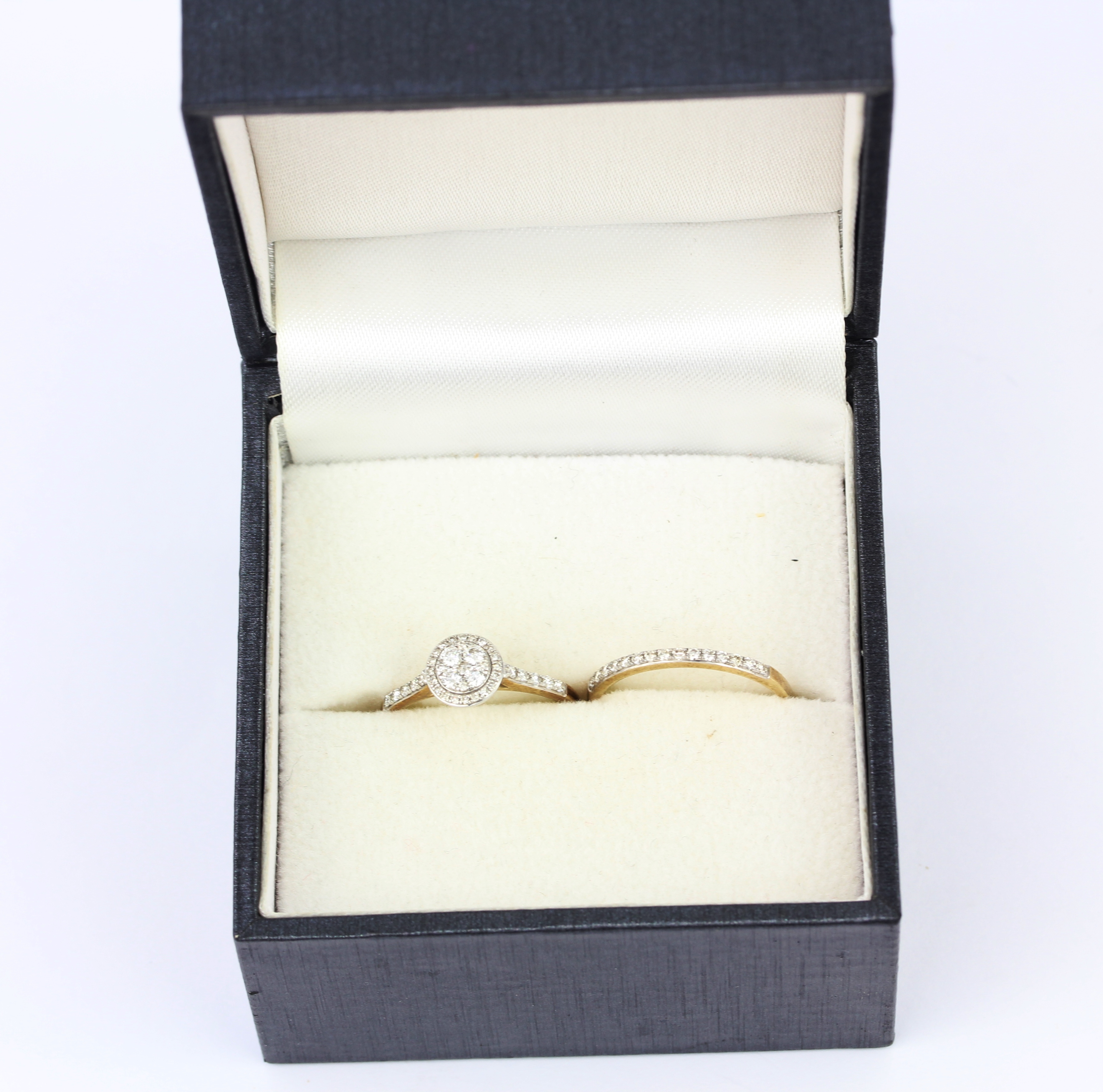 A boxed set of matching 9ct gold engagement cluister ring and half eternity wedding ring, set with - Image 3 of 5