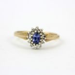 A 9ct yellow gold sapphire an diamond set cluster ring, (L.5).