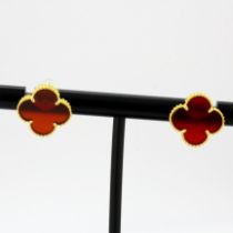 An 18ct yellow gold cornelian set stud earrings, L. 15mm.