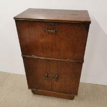 An early 20thC oak drop-down cocktail cabinet, 103 x 62 x 37cm.