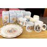 A group of Royal Albert Beatrix potter boxed figures together with royal memorabilia cups and a