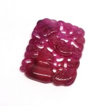 A Chinese carved tourmaline amulet, 6 x 5cm.