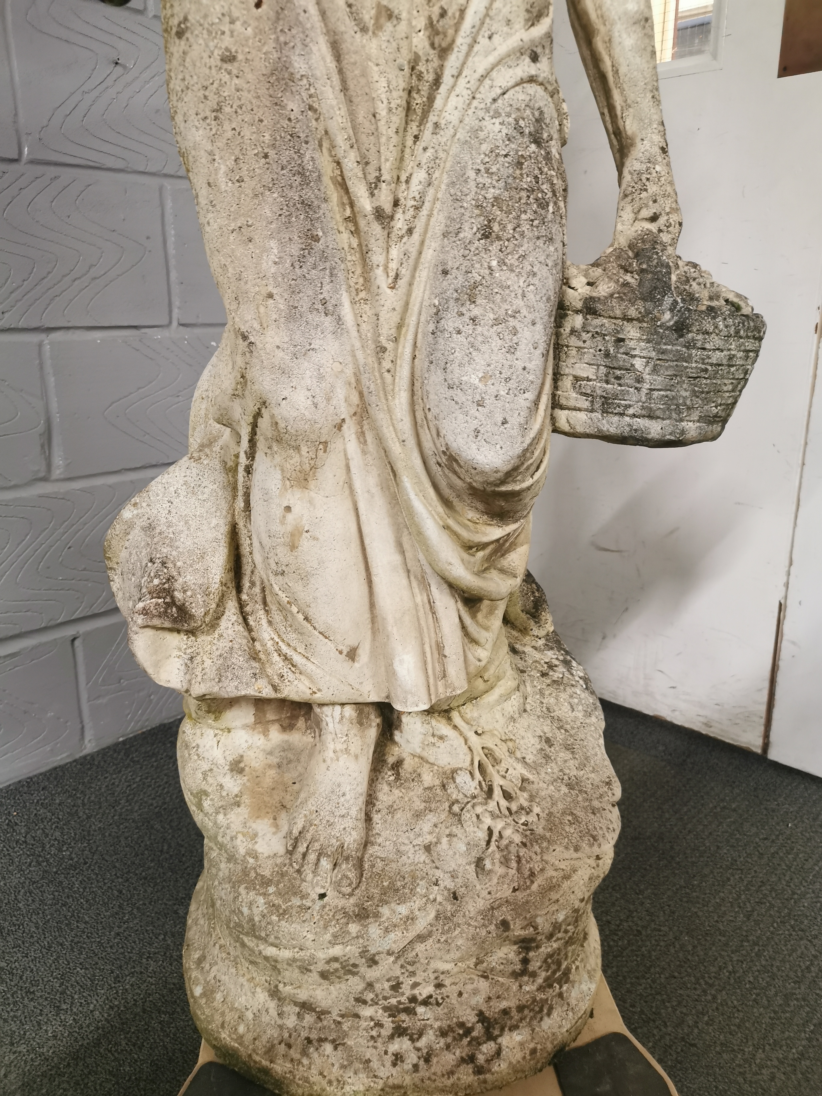 A large antique carved stone garden figure of a woman carrying baskets, H. 136cm base W. 40cm. - Image 3 of 7
