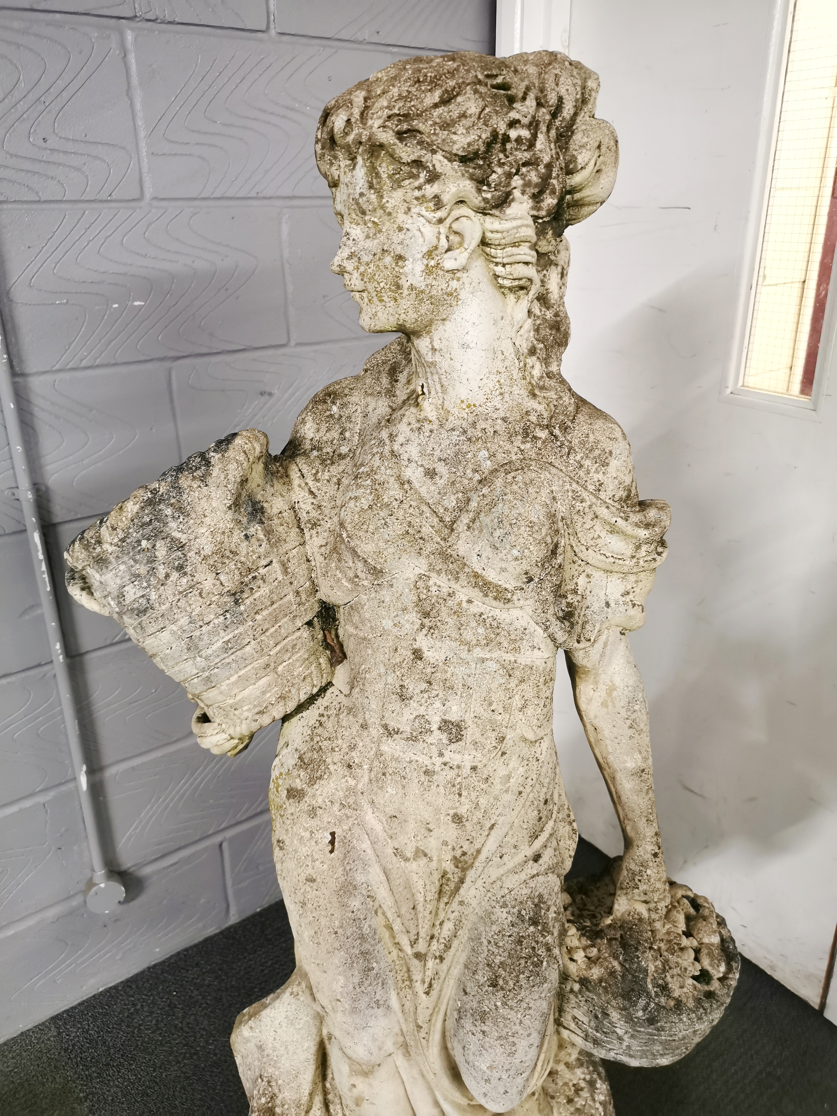 A large antique carved stone garden figure of a woman carrying baskets, H. 136cm base W. 40cm. - Image 2 of 7