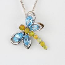 A 925 silver chain and dragonfly pendant set with blue topaz and opals.