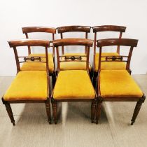 A set of six oak dining chairs with lovely back panel carving and yellow upholstered seats, H.