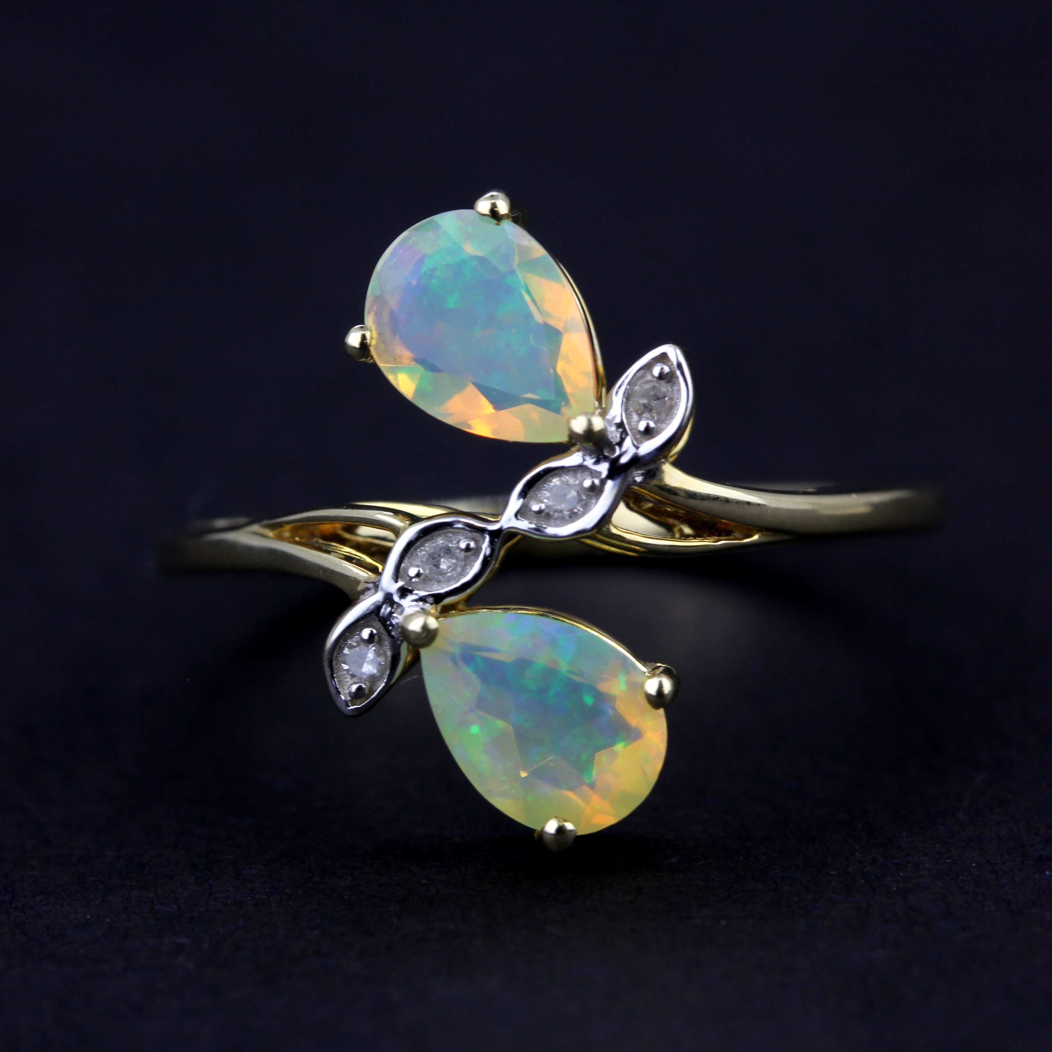 A 9ct yellow gold ring set with pear cut opals and diamonds, (O) - Image 2 of 3