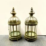 A pair of metal garden storm lanterns, H. 61cm.