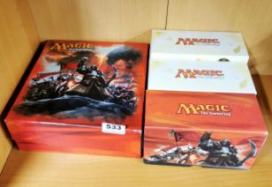 Three boxes of magic the gathering game cards.