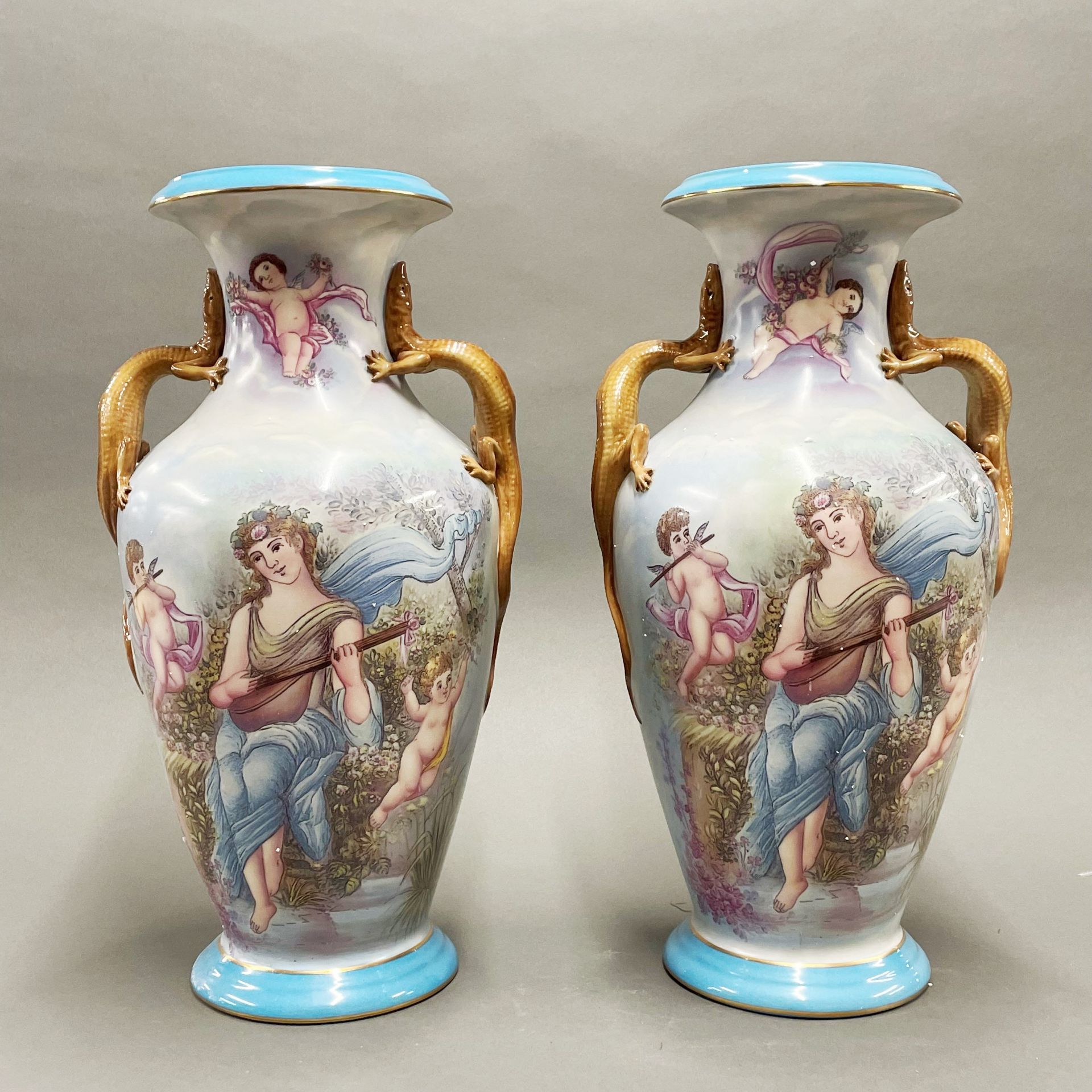 A pair of continental painted porcelain vases with lizard handles, H. 42cm, Dia. 15cm.