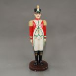 A hand painted cast iron soldier doorstop, H. 39cm.