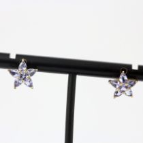 A pair of 9ct yellow gold tanzanite set flower shaped earrings, Dia. 1cm.
