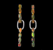 A pair of 925 silver drop earrings set with oval cut opals and white stones, L. 4.5.