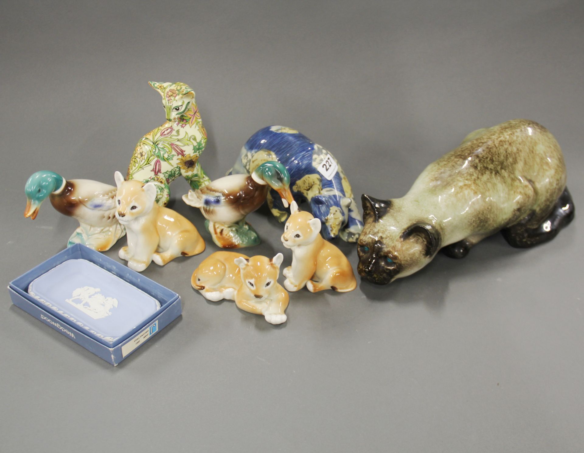 A Winstanley cat (small chip to ear), L. 38cm, together with a group of Russian and other china