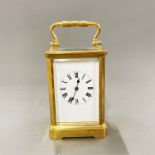 A gilt brass chiming carriage clock, understood to be in working order, H. 16cm.