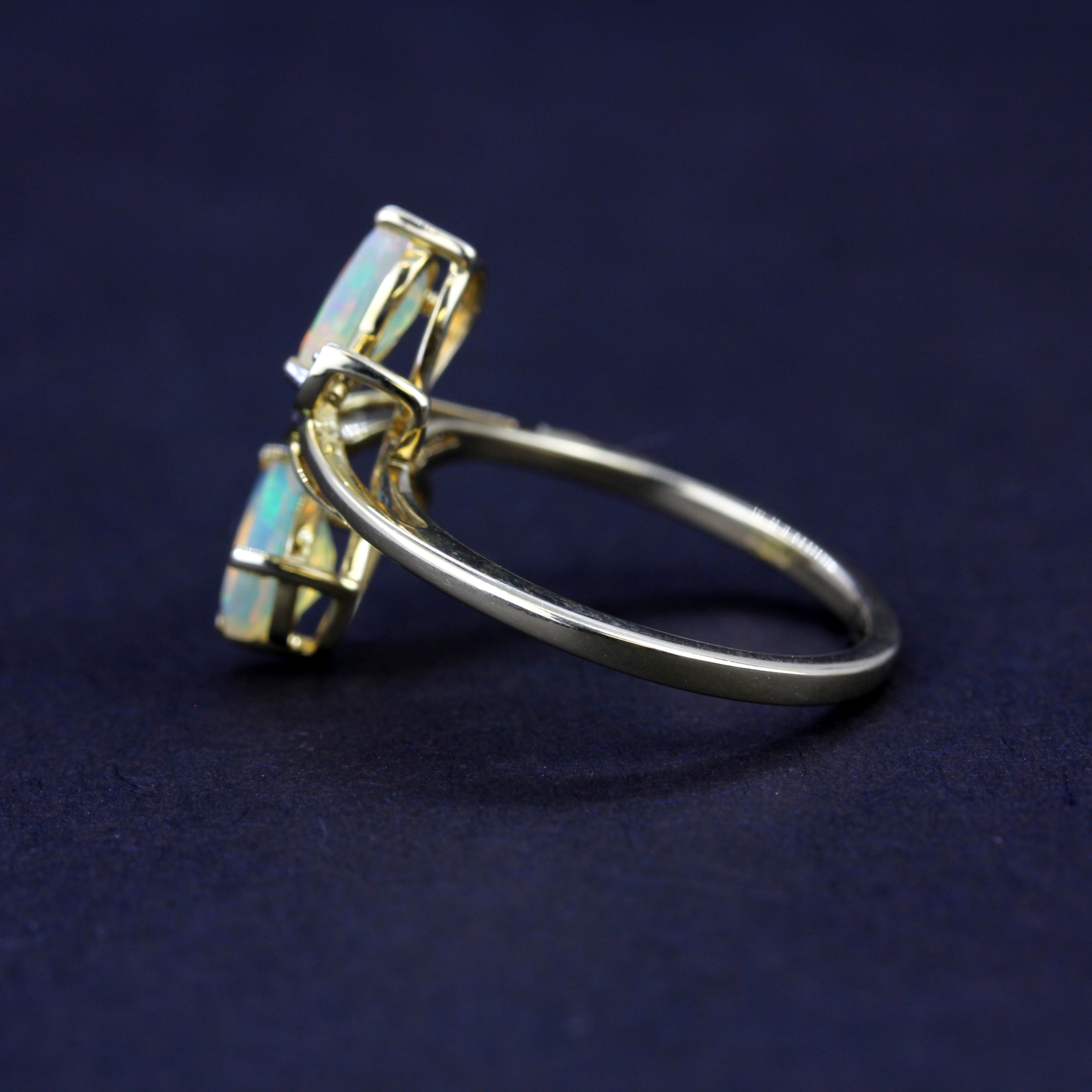 A 9ct yellow gold ring set with pear cut opals and diamonds, (O) - Image 3 of 3