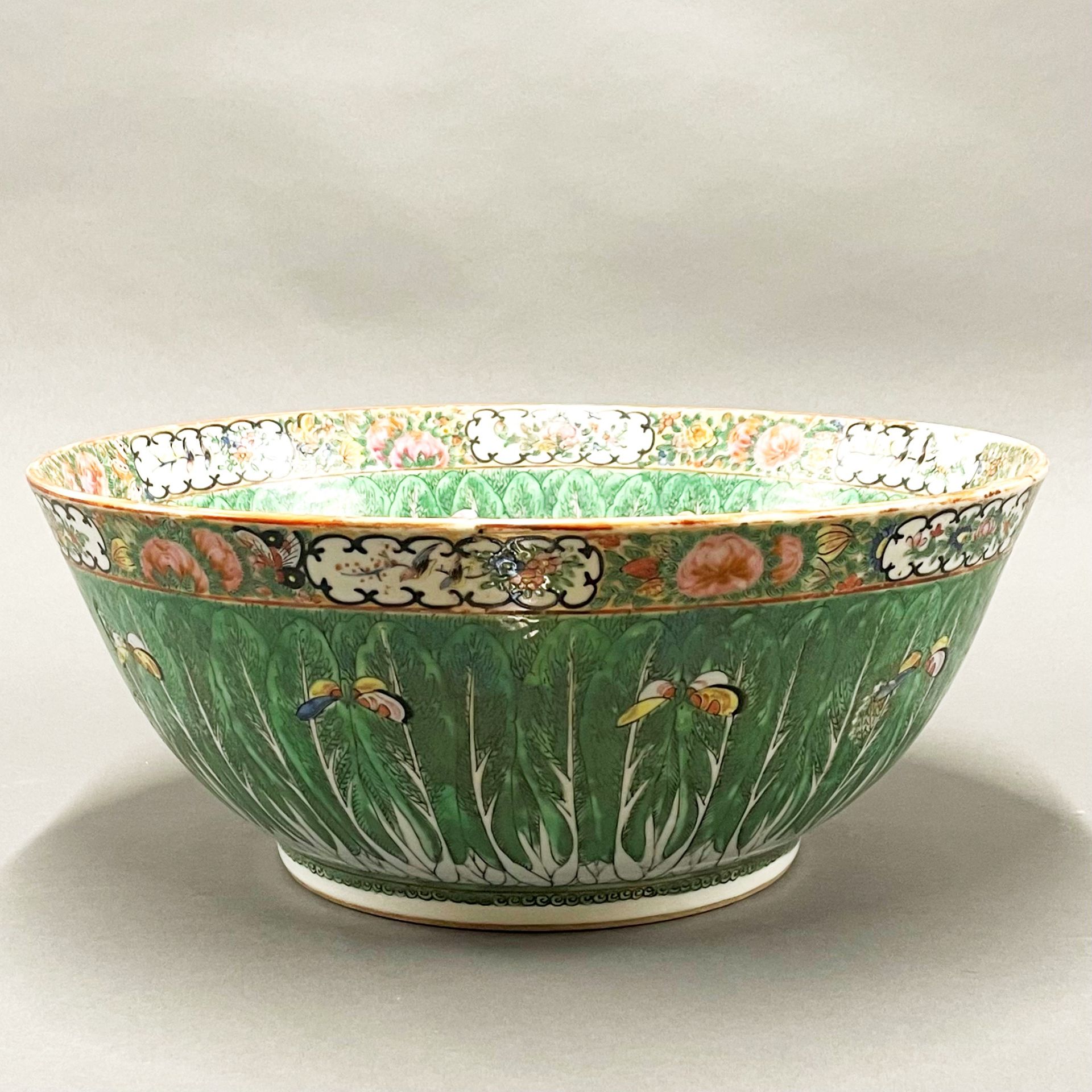 A large 19thC Chinese Canton enamelled bowl, Dia. 37cm, H. 15cm. Museum style restoration to rim.