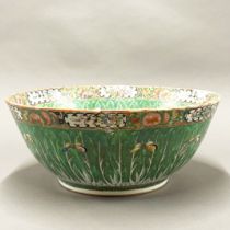 A large 19thC Chinese Canton enamelled bowl, Dia. 37cm, H. 15cm. Museum style restoration to rim.